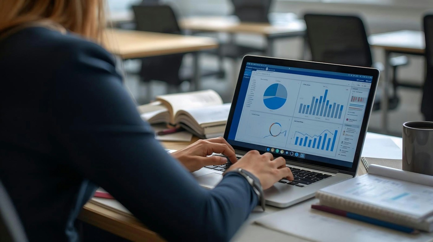 Reviewing online analytics and reports on a laptop